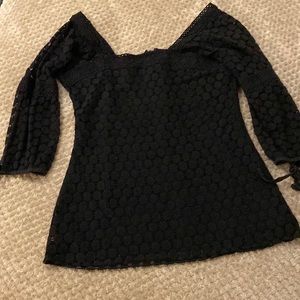 Women’s size medium black 3/4 length sleeve shirt.